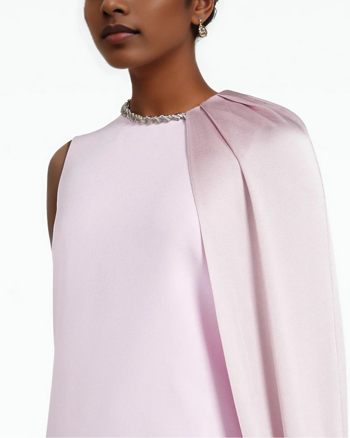 Sleeveless column gown with cascading side cape – Neiven