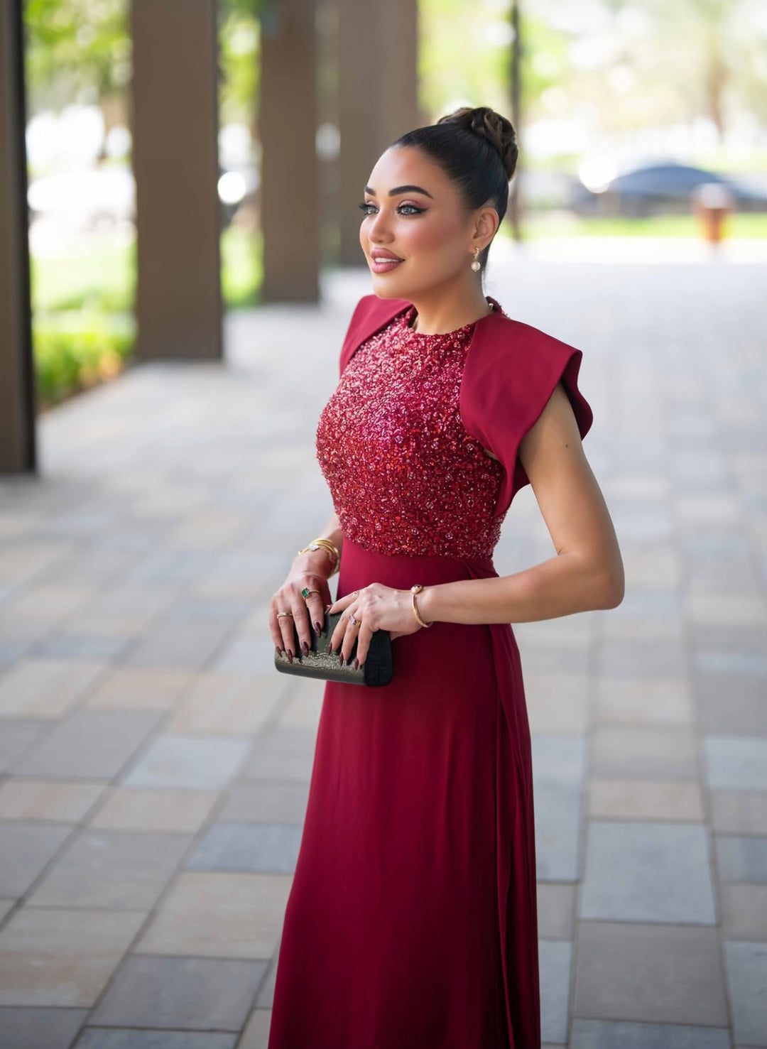 sleeveless gown with sequined bodice and structured cape shoulders – RELYE
