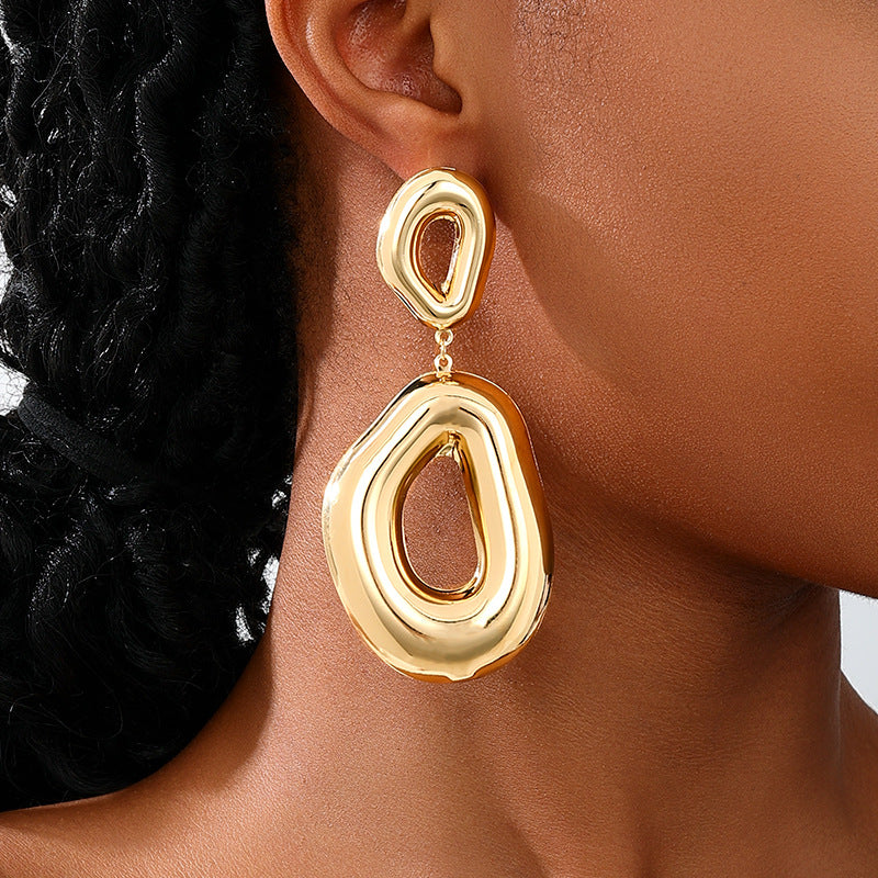 Bold molten drop earring with open center – Zindu