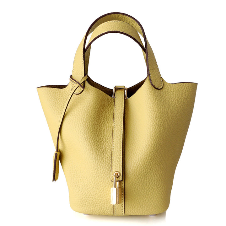 textured leather tote bag with lock detail – AURA
