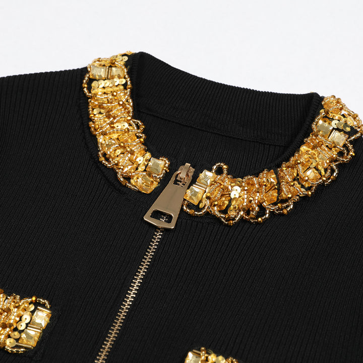 بلوزة محبوكة بأكمام قصيرة ورقبة مرصعة بالجواهر – أوراكسي