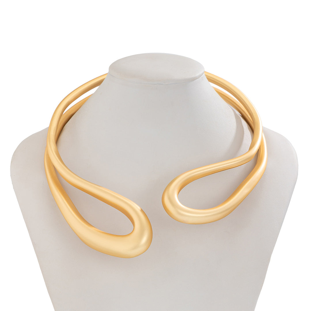 Twisted open metal choker with sculptural wave design - Dolkia