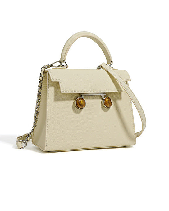 structured top-handle bag with tortoiseshell clasp - DALCIA