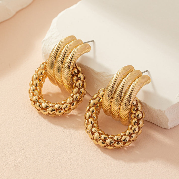 Textured twisted loop earrings with hammered ring drop – Alkobi