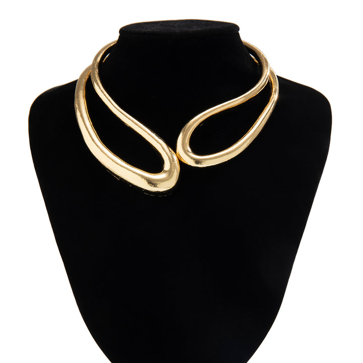 Twisted open metal choker with sculptural wave design - Dolkia
