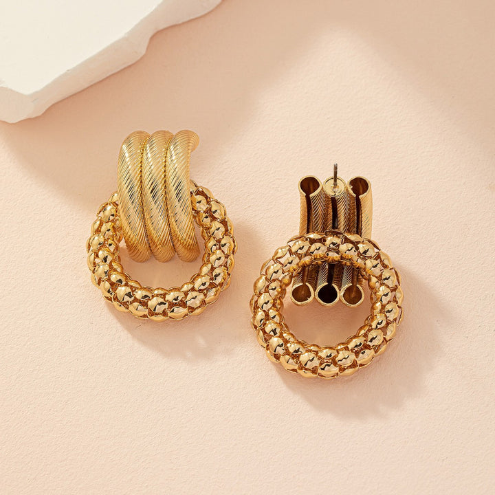 Textured twisted loop earrings with hammered ring drop – Alkobi