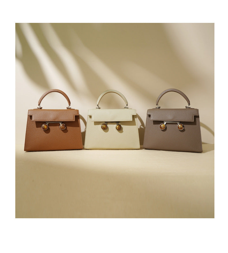 structured top-handle bag with tortoiseshell clasp - DALCIA