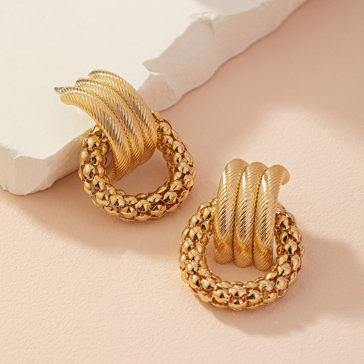 Textured twisted loop earrings with hammered ring drop – Alkobi