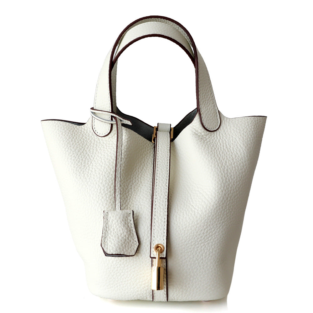textured leather tote bag with lock detail – AURA