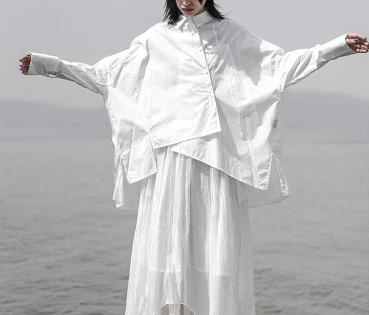 asymmetrical oversized shirt with draped hem - Taura