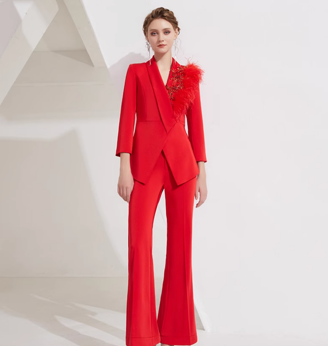 asymmetrical flare suit with feather brooch detail – CARMINE
